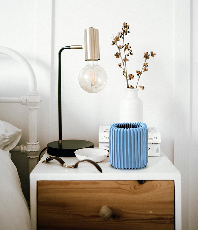 The Sigvaris Doff N' Donner Rolly® sitting on a bedside table
