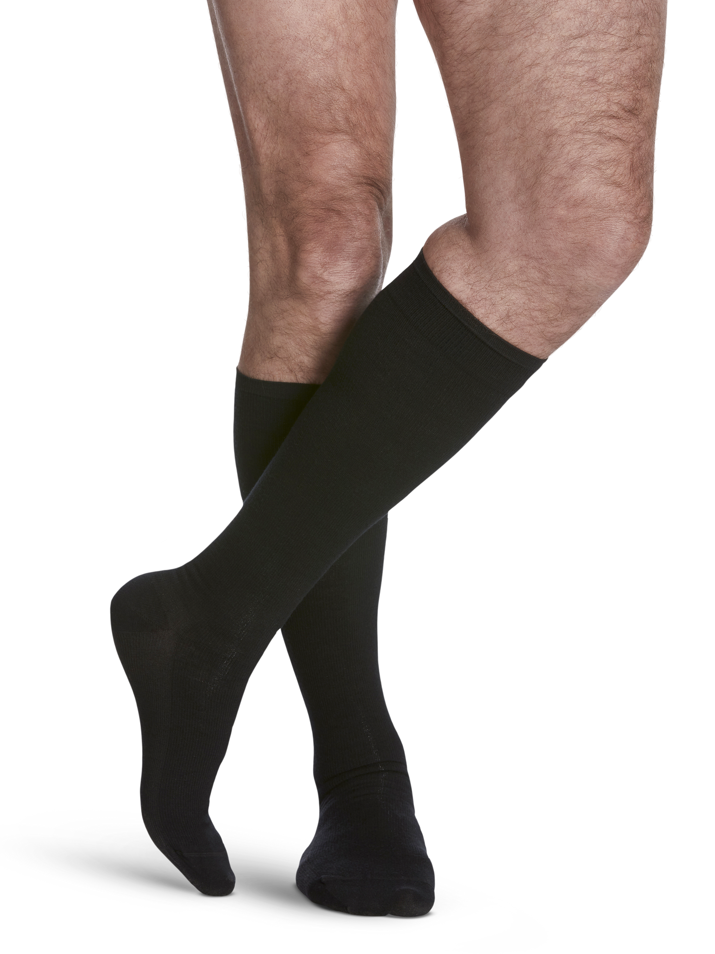 Man wearing All-Season Merino Wool compression socks in the color Black