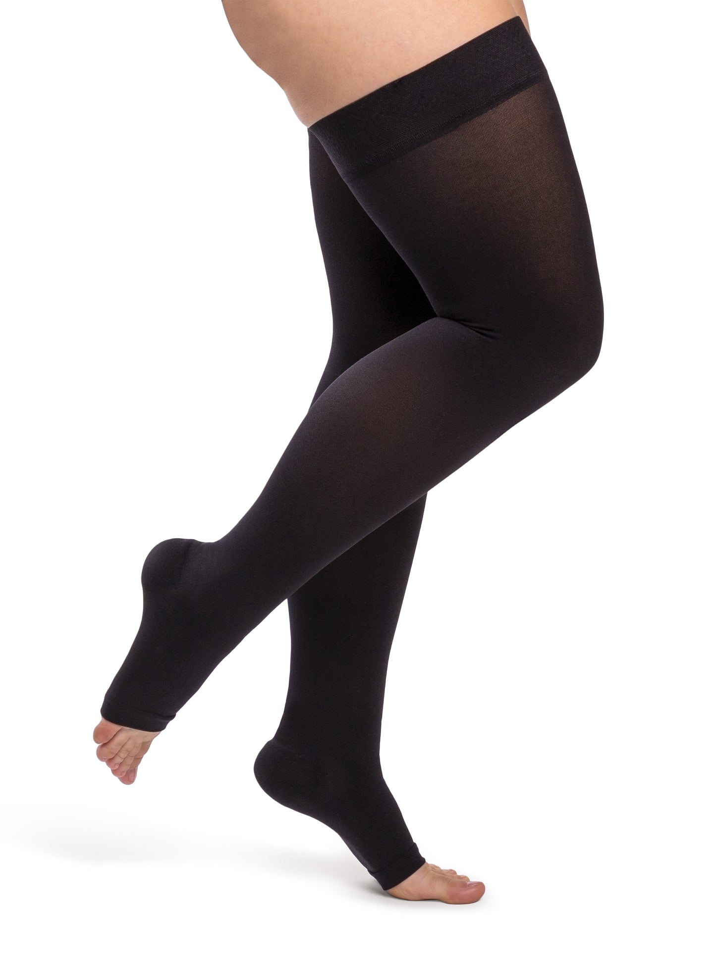 Woman wearing Sigvaris Women's Essential Opaque open-toe compression thigh-highs in the color Black