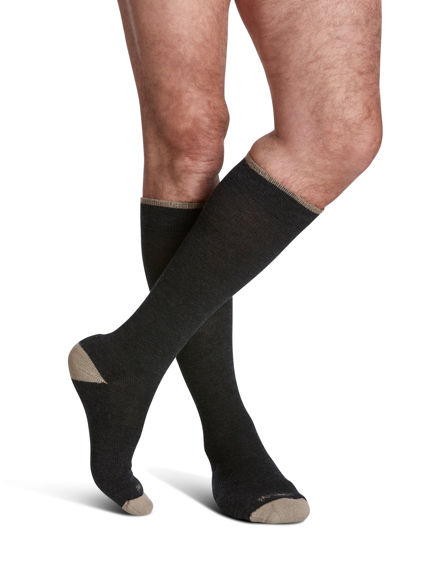Man wearing Sigvaris Men's Motion Thermoregulating Wool compression socks in the color Charcoal