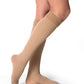 Woman wearing Sigvaris Women's Essential Cotton compression grip-top knee-highs in the color Light Beige