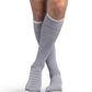 Man wearing Sigvaris Motion Flow Tech compression socks in the color Cool Grey