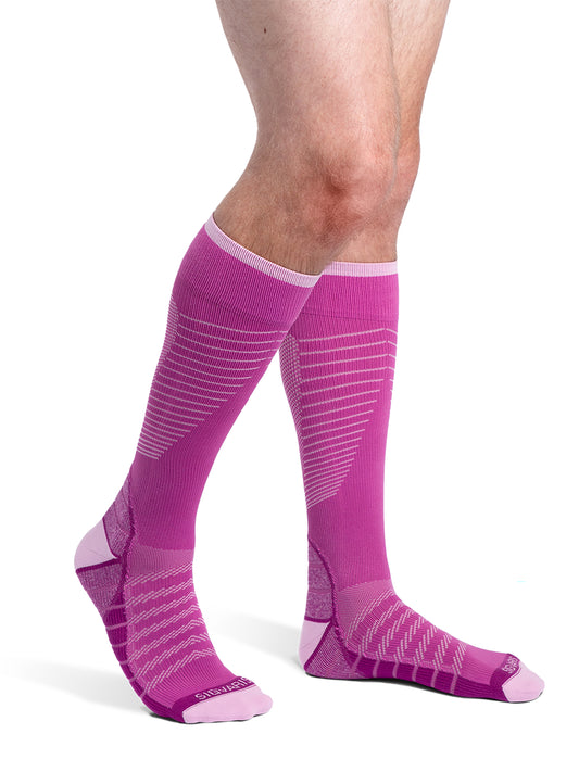 Man wearing Sigvaris Men's Motion Flow Tech compression socks in the color Orchid