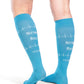 Back view of a woman wearing Sigvaris Well-being Microfiber Shades compression socks in the color Nurse Blue