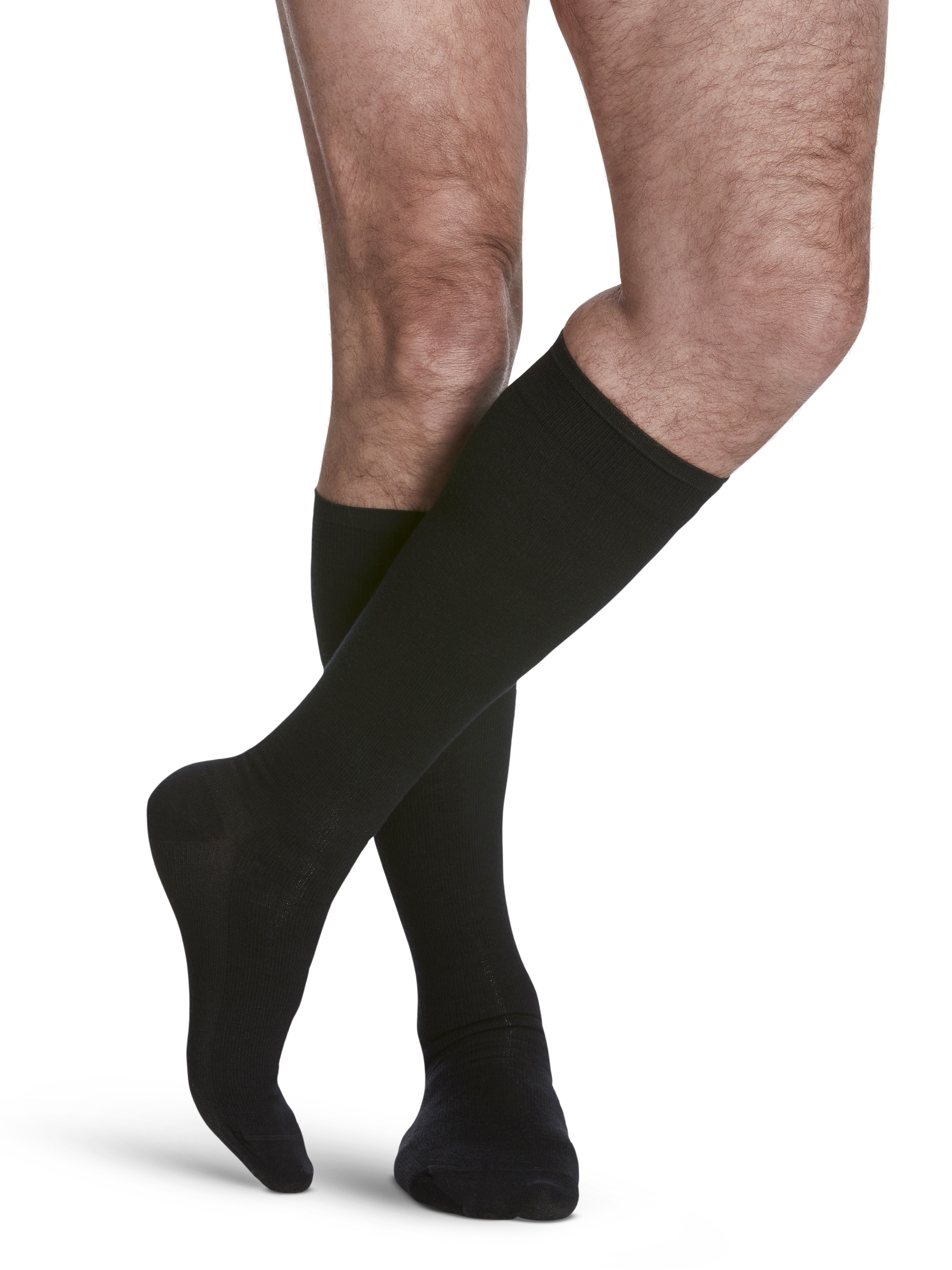 Man wearing All-Season Merino Wool compression socks in the color Black