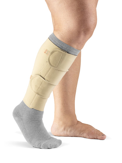 Woman wearing Sigvaris Compreflex Standard Calf inelastic compression garment in the color Beige
