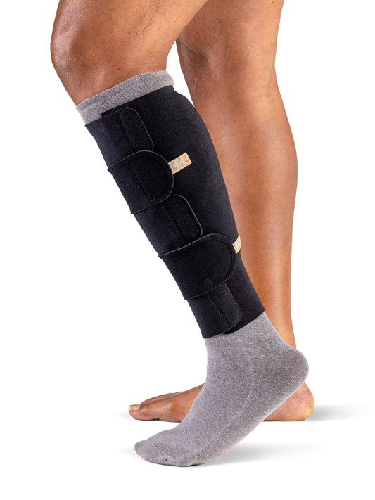 Woman wearing Sigvaris Compreflex Standard Calf inelastic compression garment in the color Black
