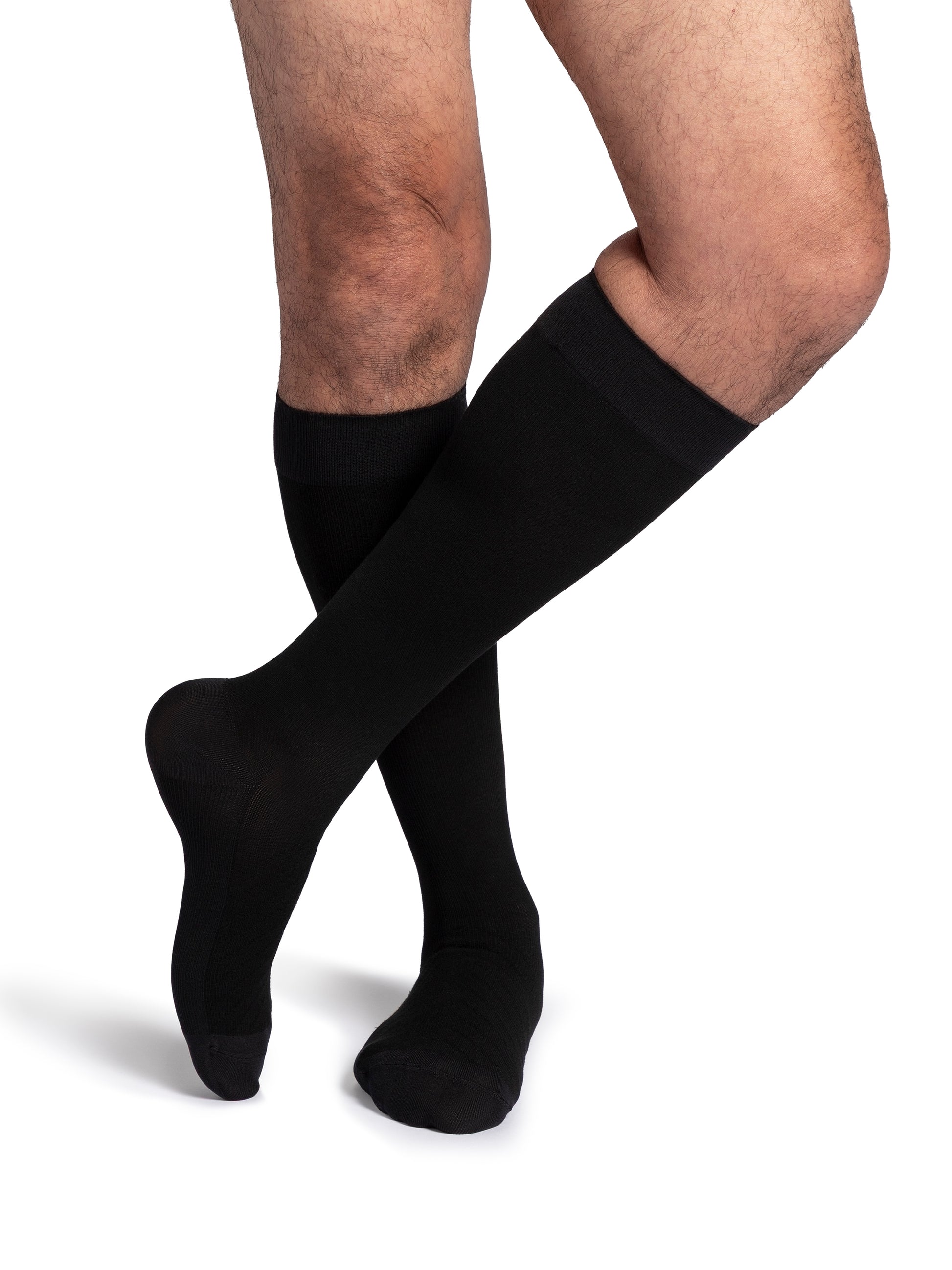 Man wearing Sigvaris Style Bamboo compression socks in the color Black