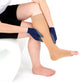 Woman using Sigvaris Textile Gloves donning gloves to adjust compression stocking on her leg