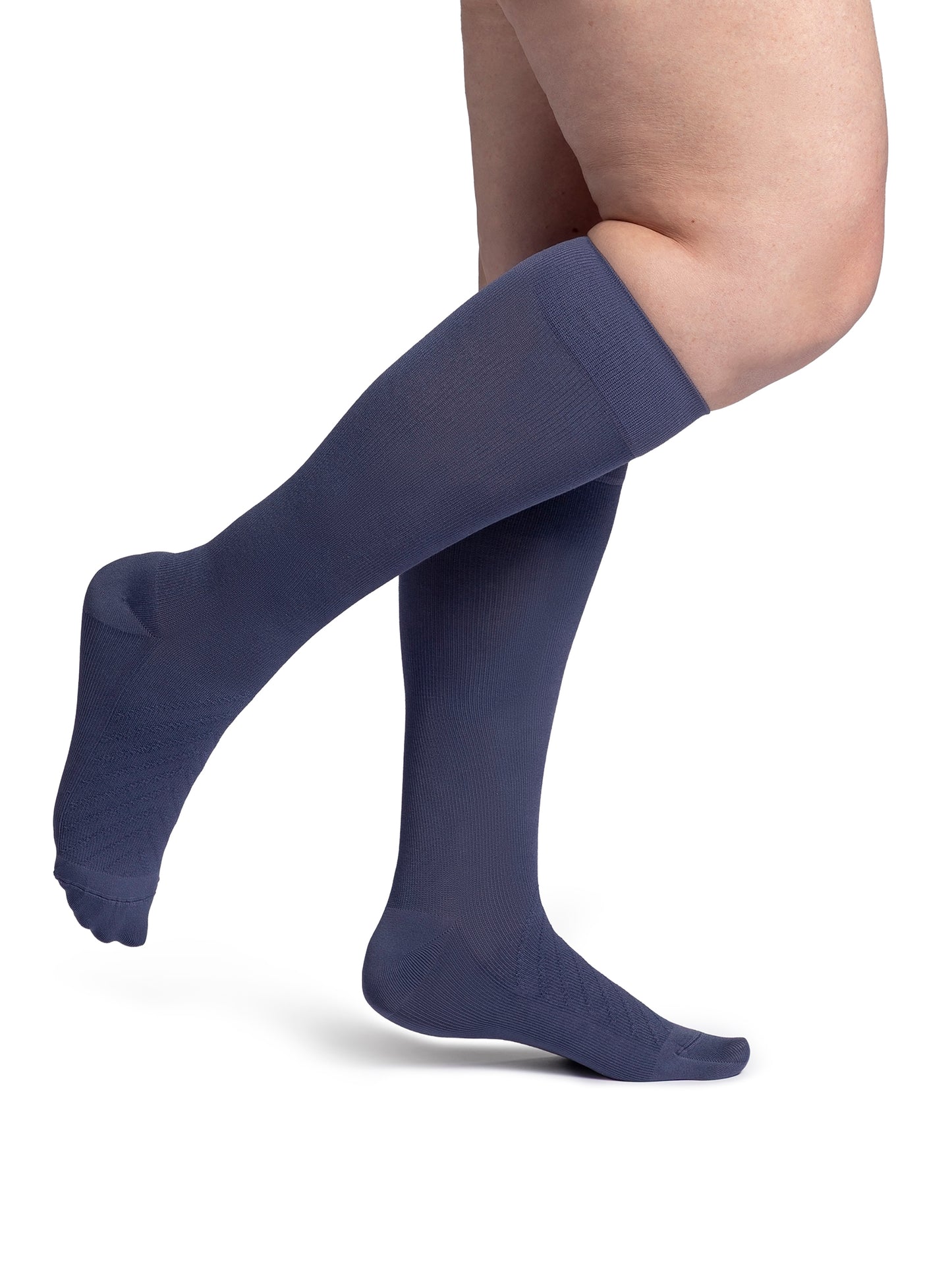 Woman wearing Sigvaris Style Bamboo compression socks in the color Dusk Violet
