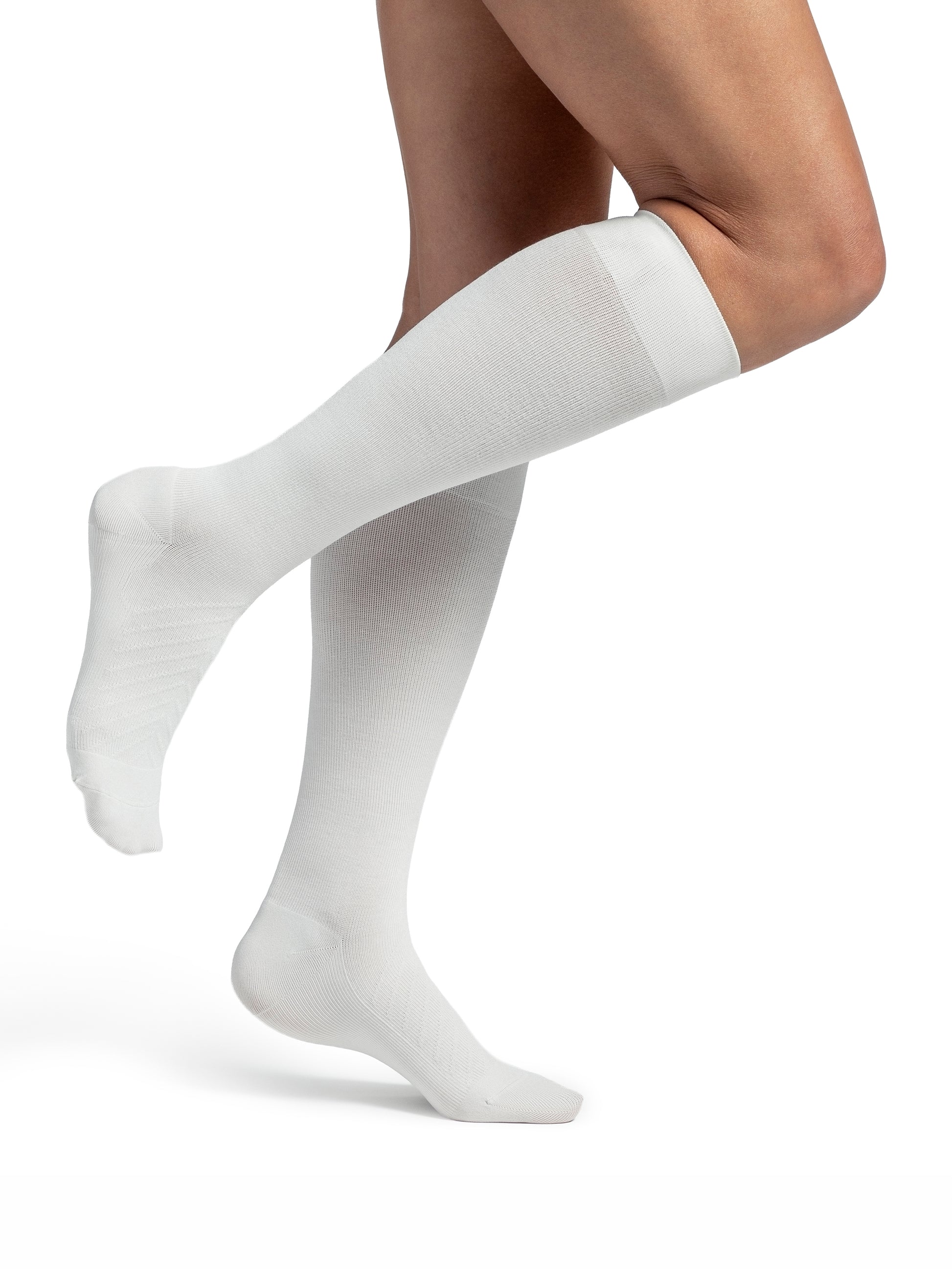 Woman wearing Sigvaris Style Bamboo compression socks in the color Ivory