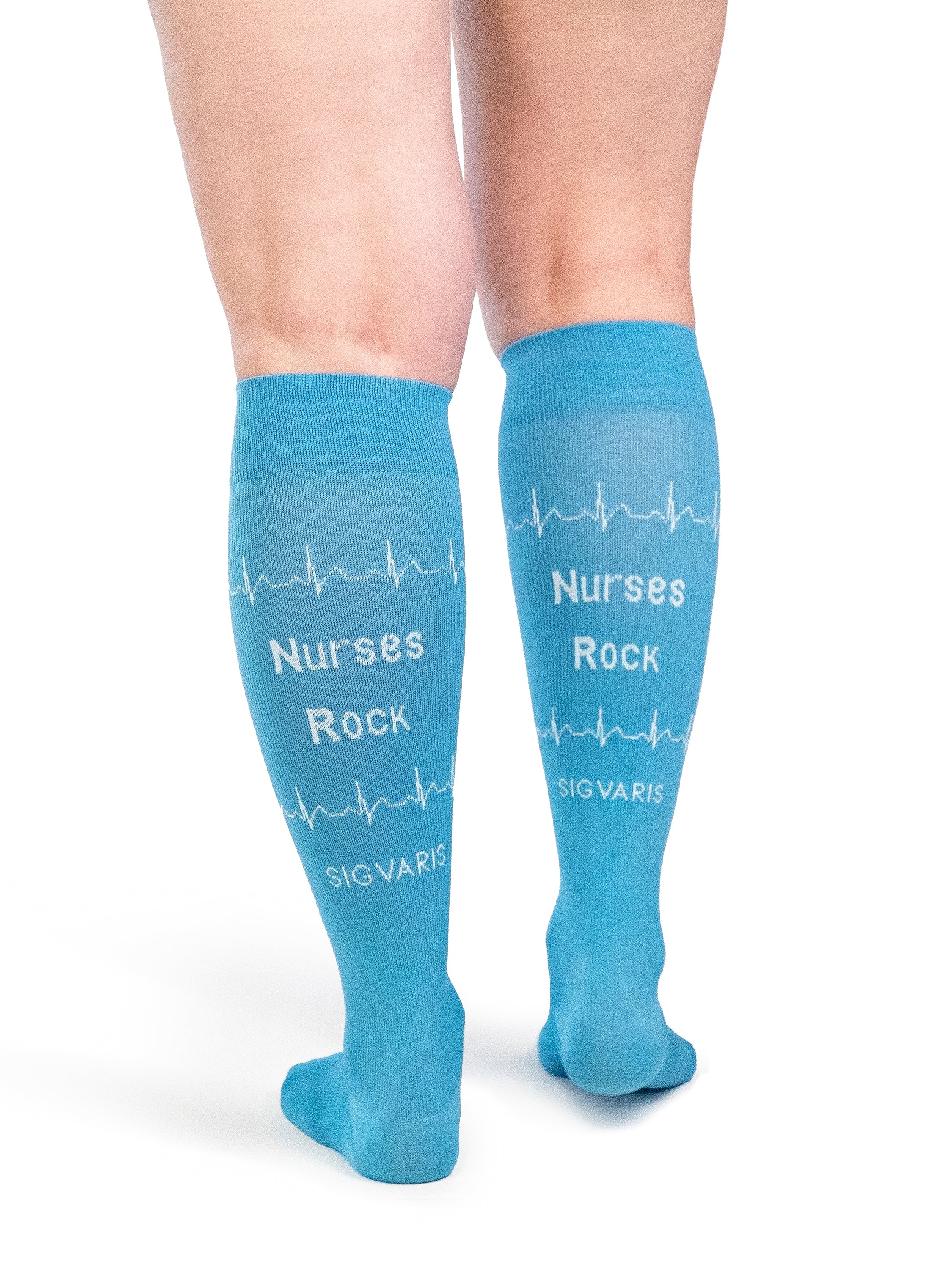 Back view of a woman wearing Sigvaris Wellbeing Microfiber Shades compression socks in the color Nurse Blue