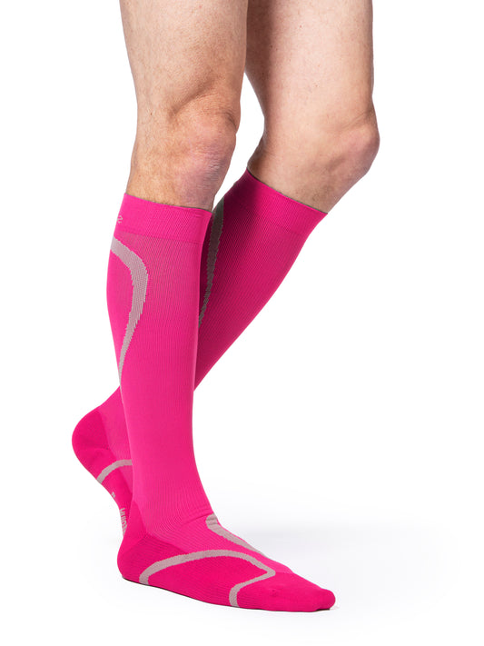 Man wearing Sigvaris Men's Motion High-Tech compression socks in the color Pink