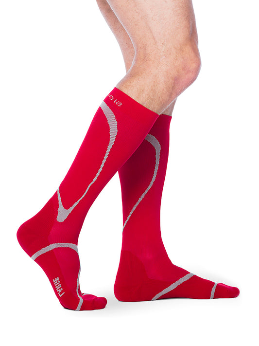 Man wearing Sigvaris Men's Motion High-Tech compression socks in the color Red