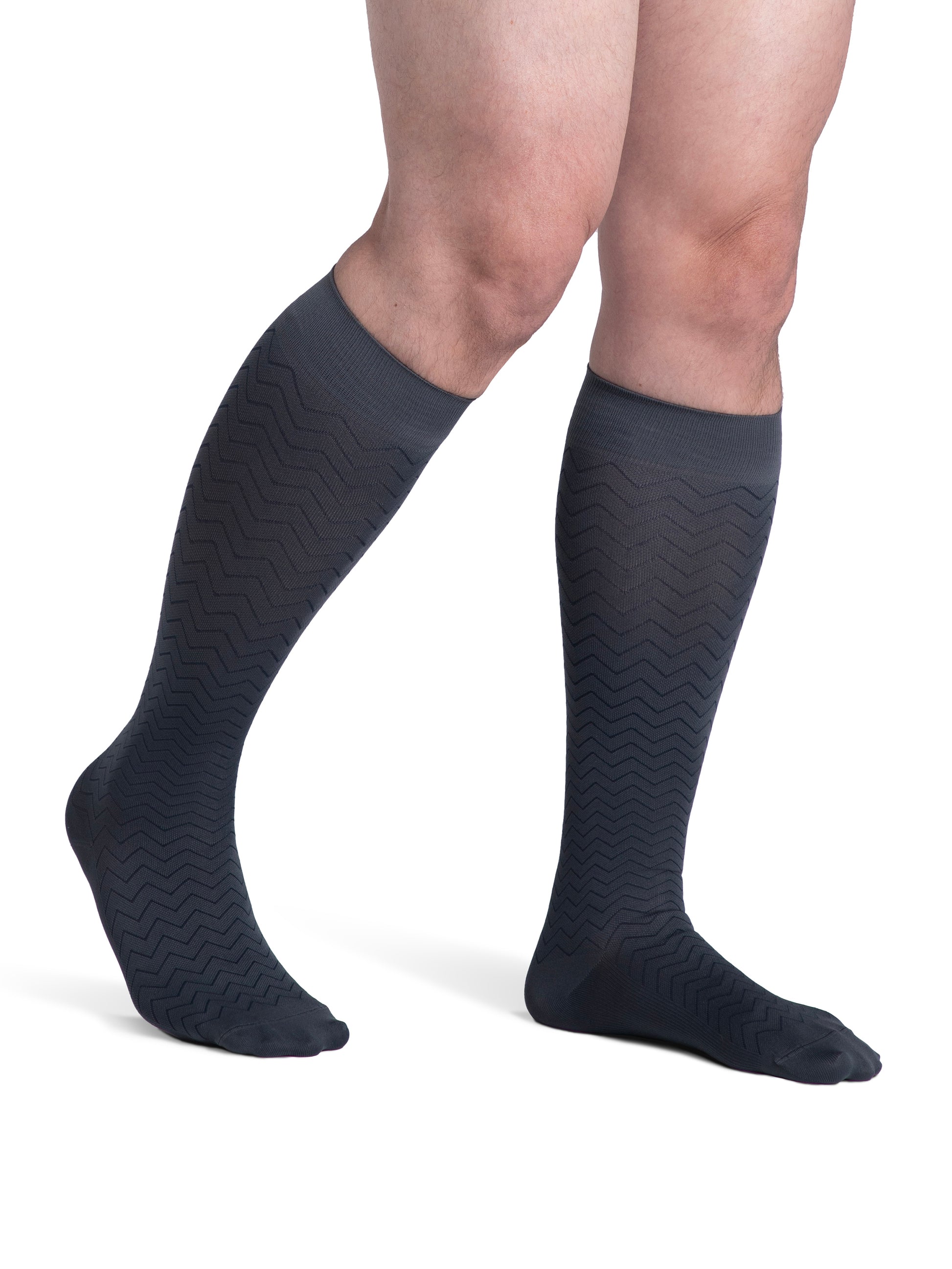 Man wearing Sigvaris Style Microfiber Patterns compression socks in the color Graphite Chevron