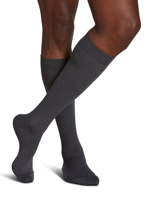 Man wearing Sigvaris Style Microfiber Patterns compression socks in the color Graphite Heather