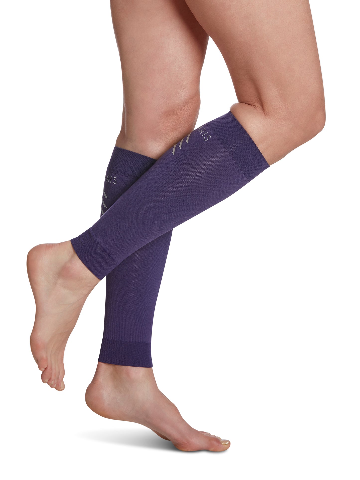 Woman wearing SIGVARIS Performance Sleeves compression calf sleeves in the color Purple