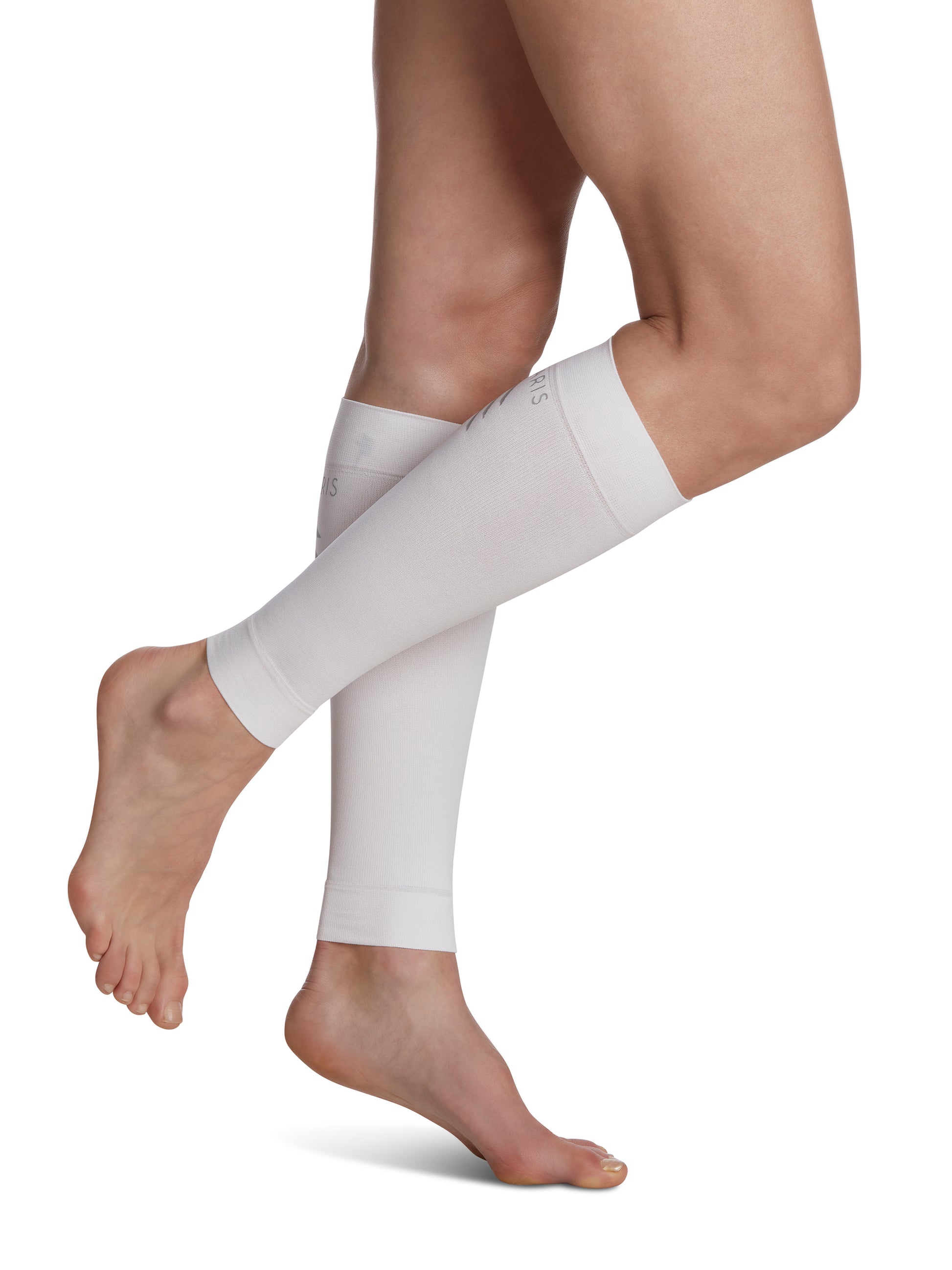 Woman wearing SIGVARIS Performance Sleeves compression calf sleeves in the color White
