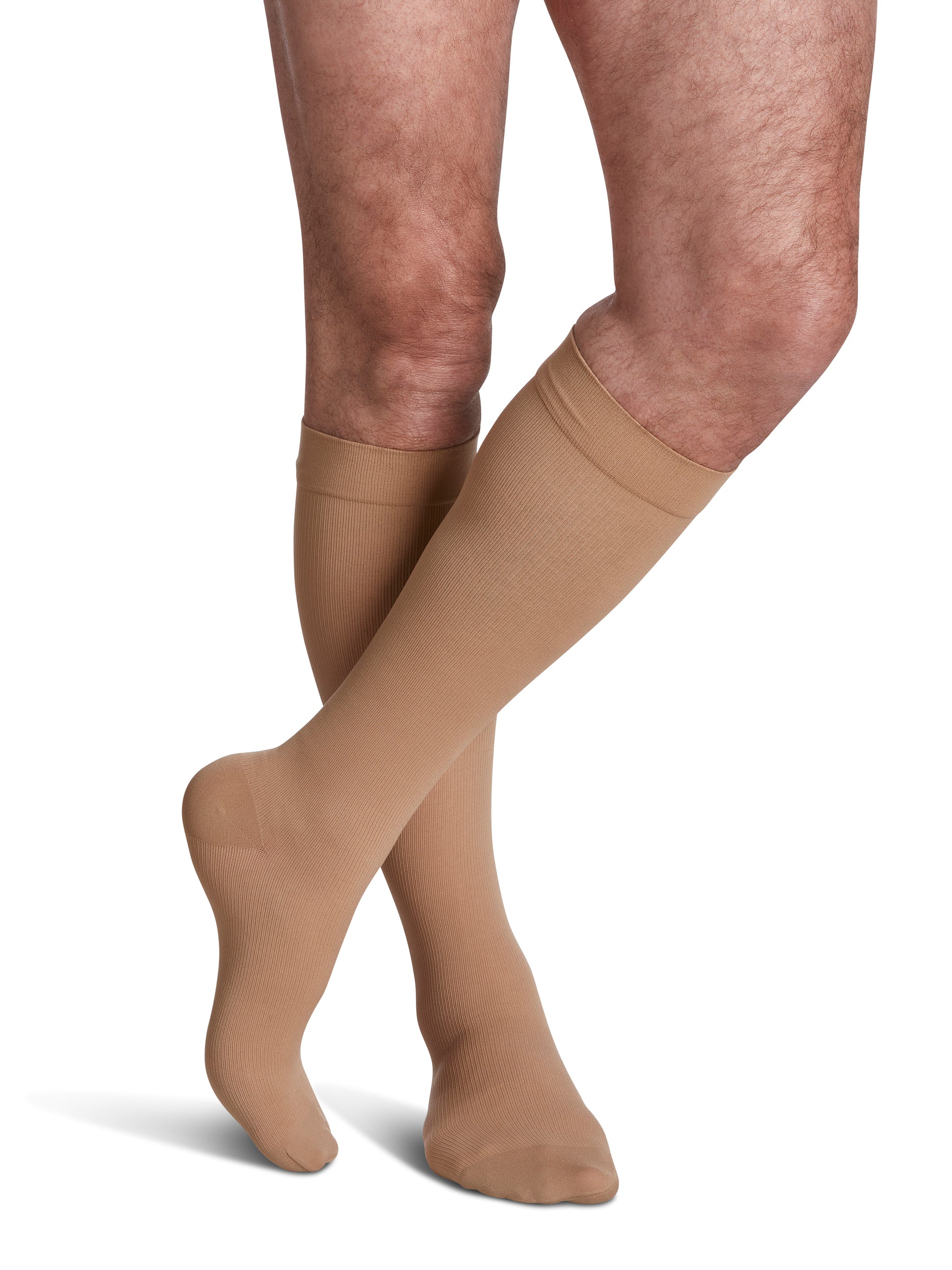 Man wearing Sigvaris Essential Opaque compression socks in the color Light Beige
