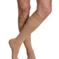 Man wearing Sigvaris Men's Essential Opaque open-toe compression stockings with grip-top in plus size  in the color Light Beige