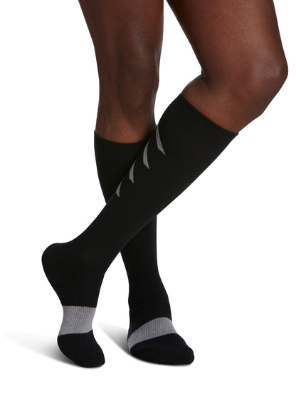 Man wearing Sigvaris Well-being Men's Athletic Recovery Calf Socks in the color Black