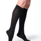Woman wearing Sigvaris Essential Cotton compression socks in the color Black